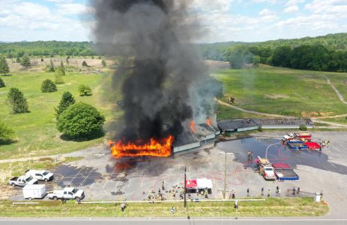 Firefighters training in live burn exercise