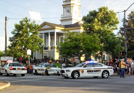 Public Safety cars parked on Sterling Street near Courthouse Square
