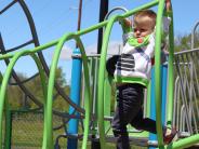 Child playing on new playground